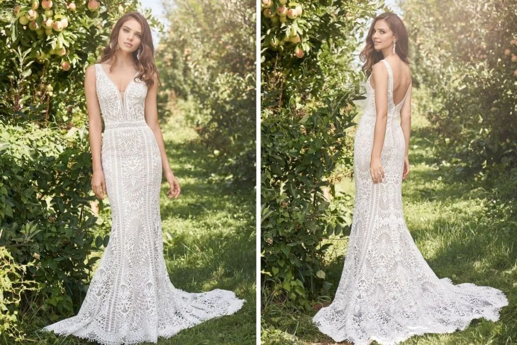 Lillian West Spotlight Event: September 2020 Side-by-side images showing the front and back of a bride wearing a boho lace fit-and-flare wedding dress with a deep V-neckline, intricate allover lace pattern, and a scalloped train, photographed in a sunlit orchard.