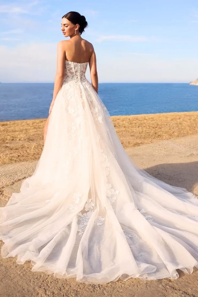 Floral Lace Tulle Ball Gown Wedding Dress Betty Floral lace ball gown wedding dress with sweetheart neckline, skirt slit, and detachable lace gloves.