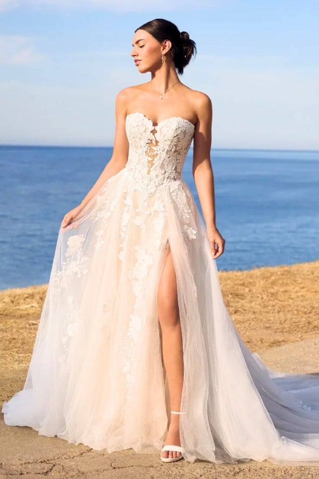 Floral lace ball gown wedding dress with sweetheart neckline, skirt slit, and detachable lace gloves.