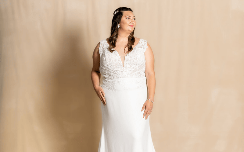 Plus-Size Wedding Dress Shopping Tips Every Bride Should Know bride wearing a plus-size wedding dress