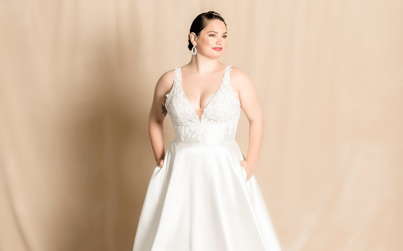 Plus-Size Wedding Dress Shopping Tips Every Bride Should Know bride wearing a plus-size wedding dress