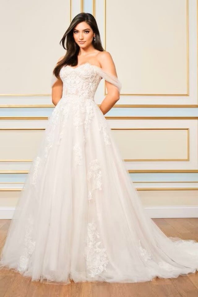 Lace ball gown wedding dress with off-the-shoulder tulle sleeves and sweetheart neckline.