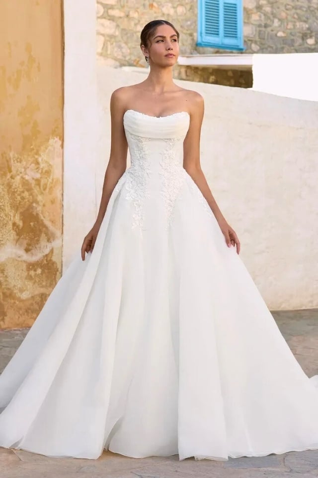 Strapless scoop neckline ball gown with lace bodice and full organza skirt.