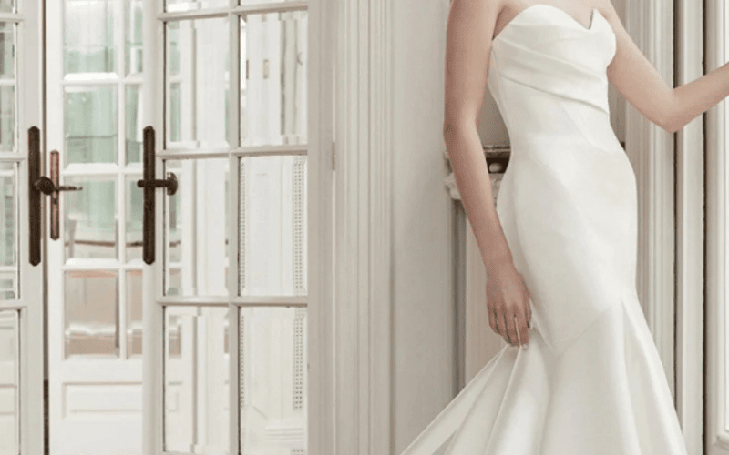 8 Stunning Wedding Dress Fabrics and How to Choose Yours bride wearing a mikado wedding dress