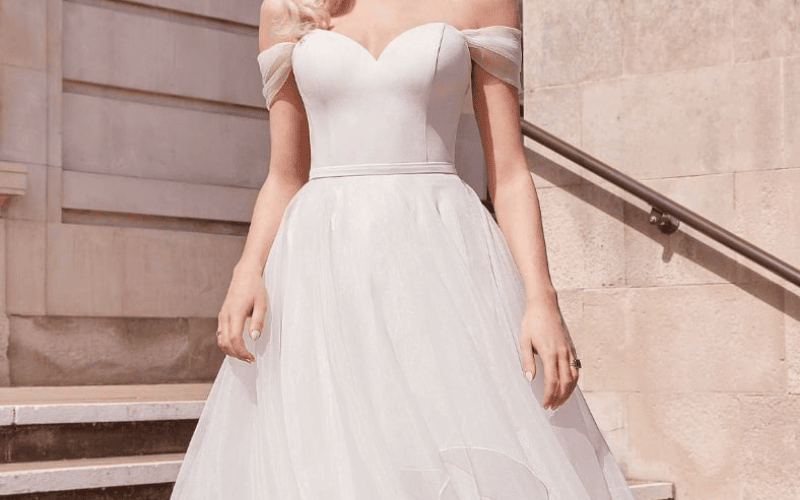 8 Stunning Wedding Dress Fabrics and How to Choose Yours bride wearing a organza wedding dress