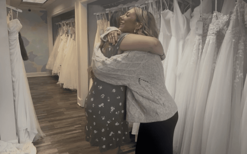 mom and bride hugging at each other