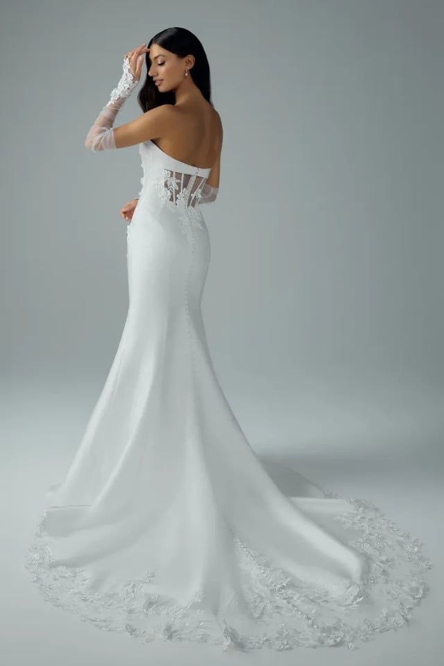 Mikado Lace Fit-and-Flare Wedding Gown Selene Style Y3226 Strapless Mikado fit-and-flare wedding gown with lace details and long train, paired with sheer lace gloves.