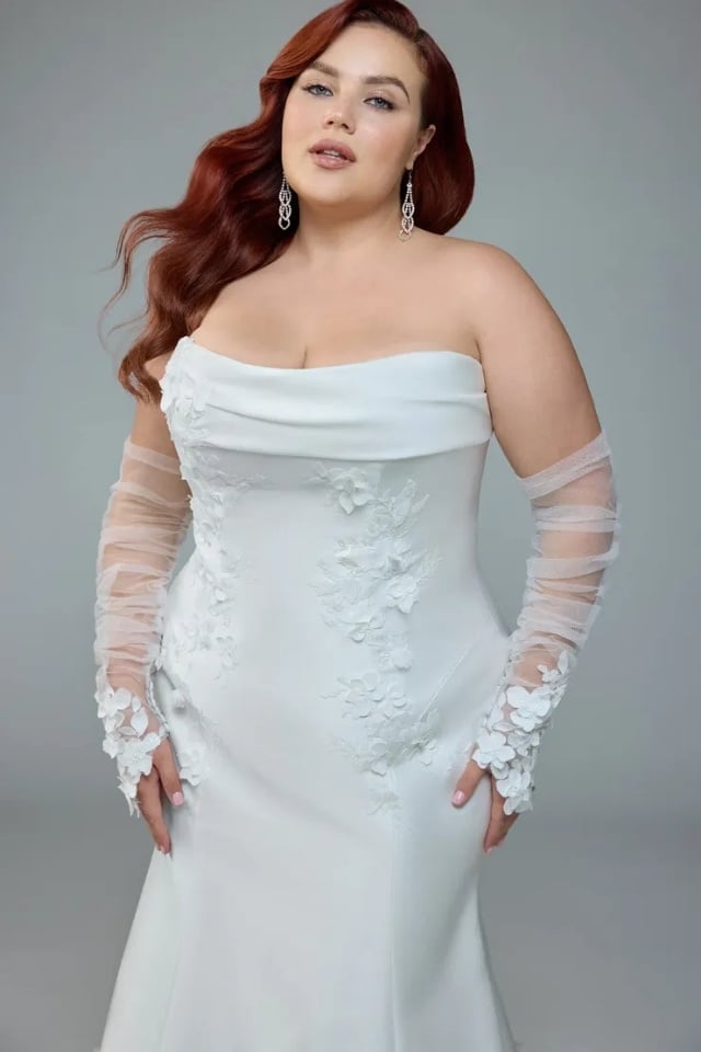 Mikado Lace Fit-and-Flare Wedding Gown Selene Style Y3226 Strapless Mikado fit-and-flare wedding gown with lace details and long train, paired with sheer lace gloves.