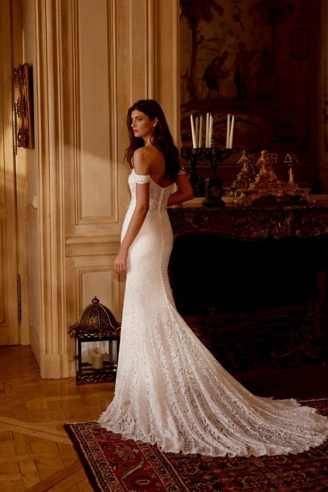 Vintage Lace Fit-and-Flare Wedding Gown Glenetta Off-the-shoulder lace fit-and-flare wedding gown with straight neckline and chapel train.