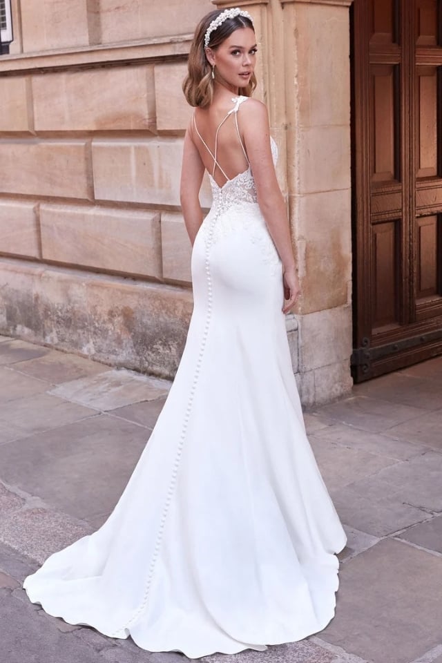 Stretch Crepe Fit-and-Flare Wedding Dress Makenna Stretch crepe fit-and-flare wedding dress with lace bodice, plunge neckline, and sweep train.