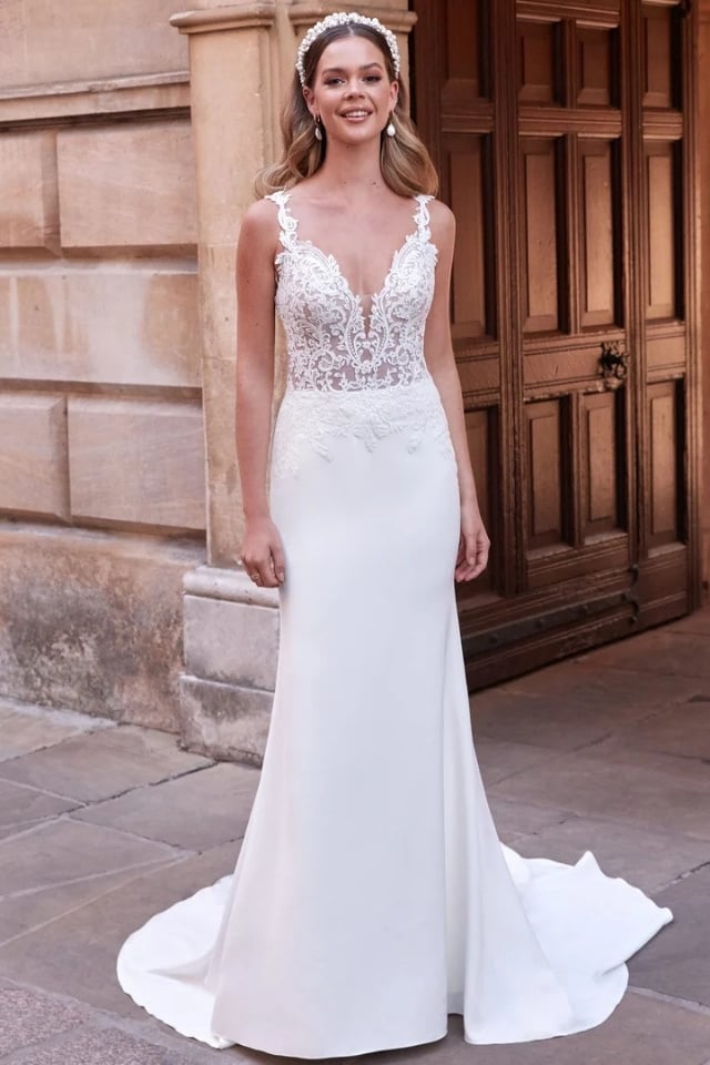 Stretch crepe fit-and-flare wedding dress with lace bodice, plunge neckline, and sweep train.