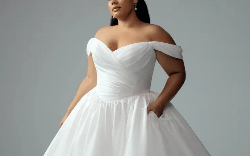 What Is a Basque Waist Wedding Dress? The Regal Trend Brides Are Loving bride in her gown