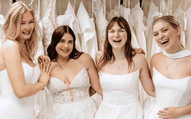 Modern Wedding Dress Styles vs. Classic Bridal Looks: How to Find Your Perfect Gown four girls laughing