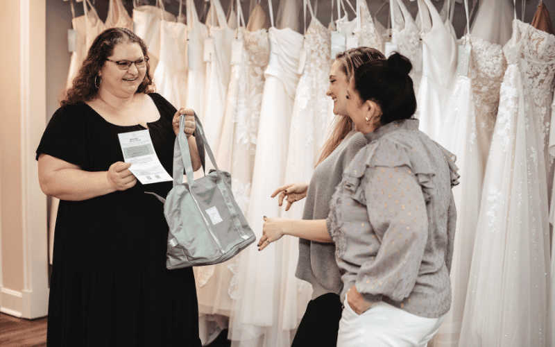 Wedding Dress Questions to Ask Your Stylist During Your Appointment bride and her stylist