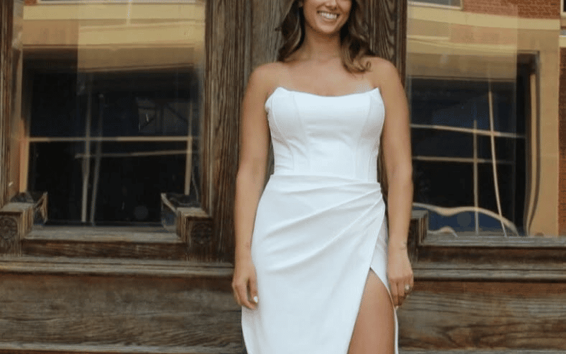 Why the Wedding Dress with Corset Bodice Is Having a Bridal Moment woman wearing a sheath gown with slit