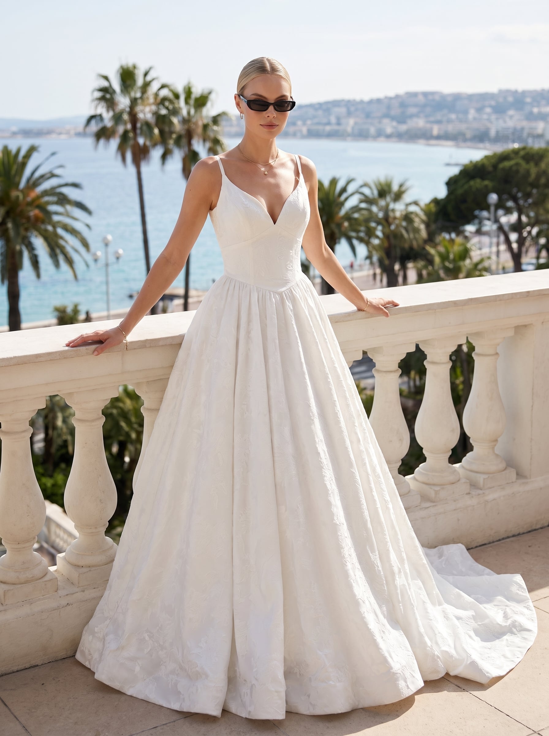 Page Updates & Announcements Elaine Nicole ivory jacquard ball gown wedding dress featuring a V-neckline, spaghetti straps, fitted bodice, pointed waistline, and full pleated skirt with a subtle floral pattern.
